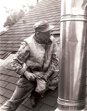 Our thrifty grandpa working on a roof